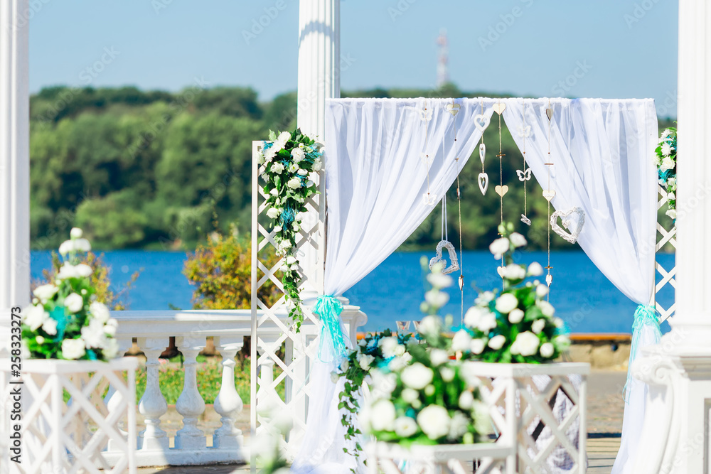 Beautiful wedding set up. Wedding ceremony on lake shore.