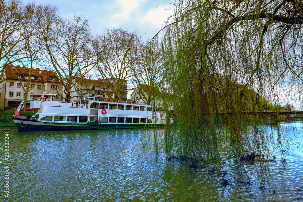 The vehicle is floating on the river. Springtime.