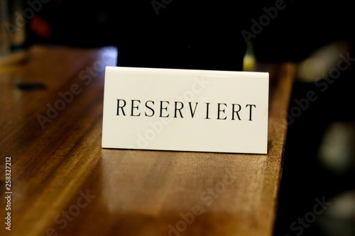 The plate with the inscription "reserved" in the German cafe.