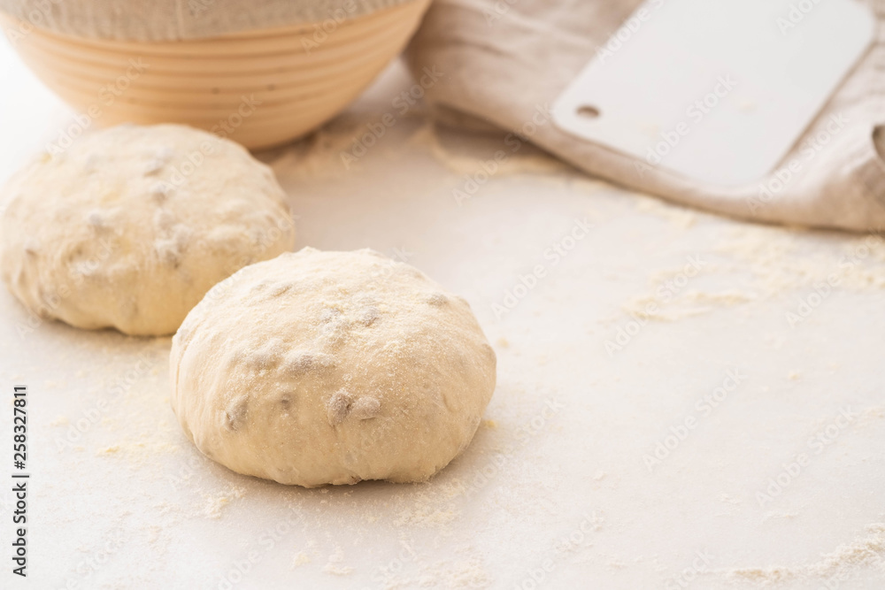 Balls of dough covered with wheat flour ready for baking. Copy space. Balls of dough covered with wheat flour ready for baking. Copy space.