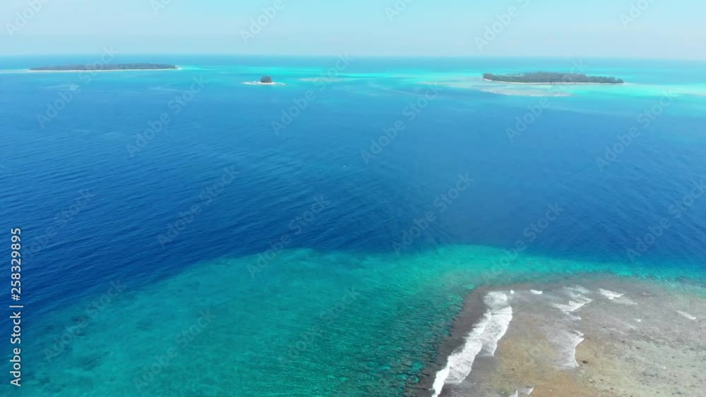 Aerial: flying over desert islands coral reef tropical caribbean sea, turquoise blue water. Indonesia Sumatra Banyak islands. travel destination diving snorkeling Aerial: flying over desert islands coral reef tropical caribbean sea, turquoise blue water. Indonesia Sumatra Banyak islands. travel destination diving snorkeling