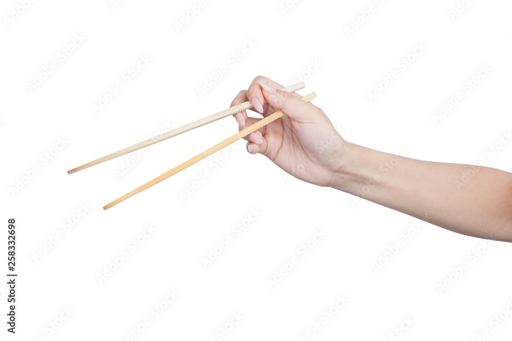 Female hand holding wooden chopsticks Female hand holding wooden chopsticks