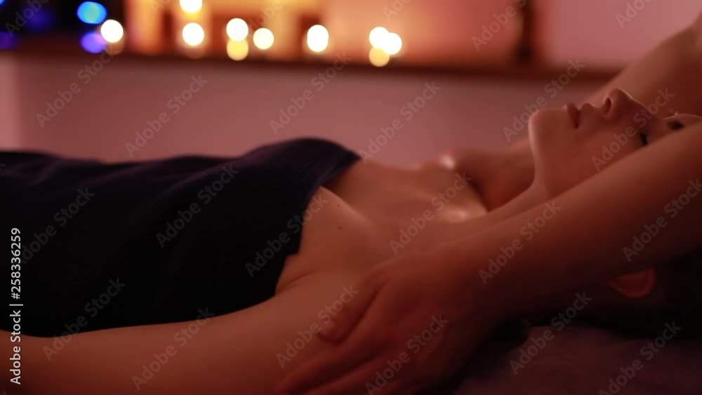 Massage treatment face procedure. Woman in professional beauty salon. Wellness, skin care. Massage treatment face procedure. Woman in professional beauty salon. Wellness, skin care.