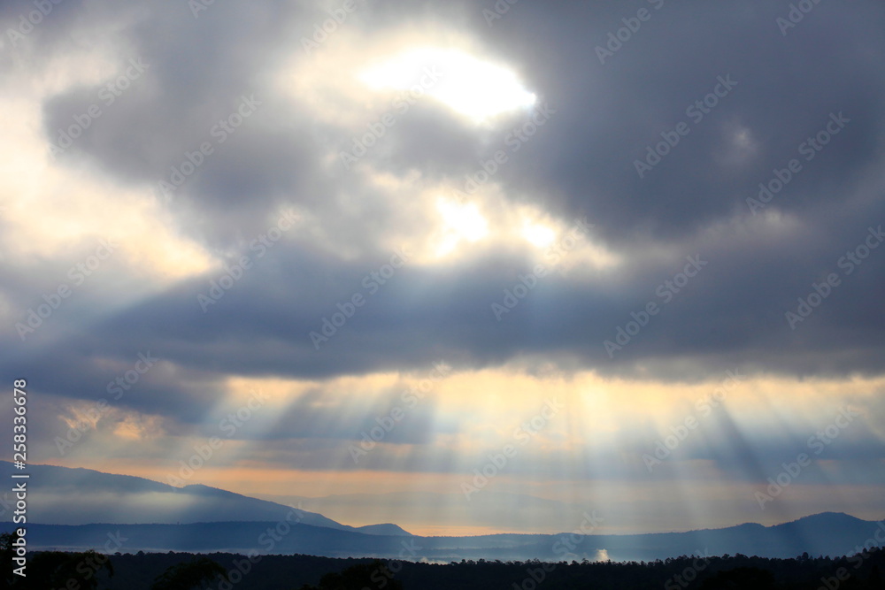 amazing sun light shines through the cloud