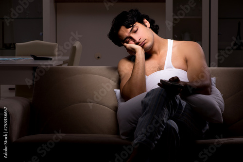 Young man suffering at home night time