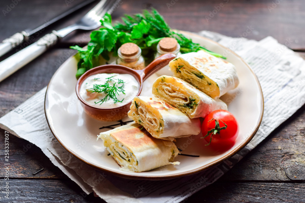 Lavash roll with cheese, herbs and sour cream.