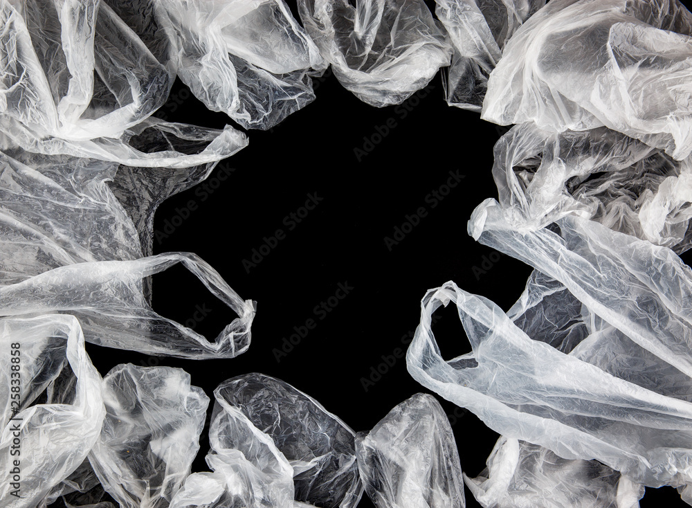 White crumpled plastic bags on black background
