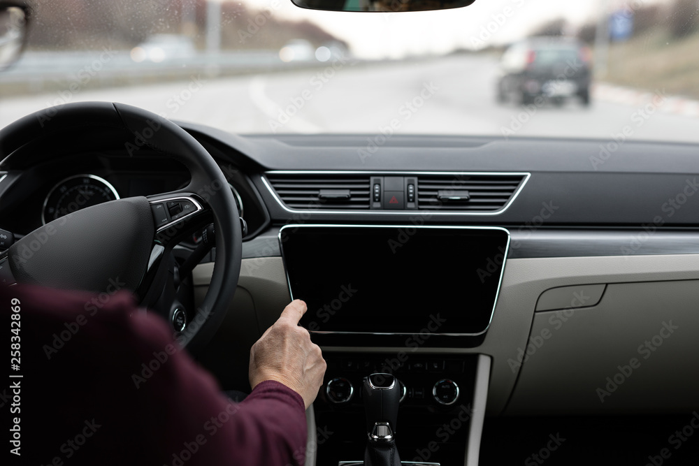 Obraz premium Close up of man using navigation in his car
