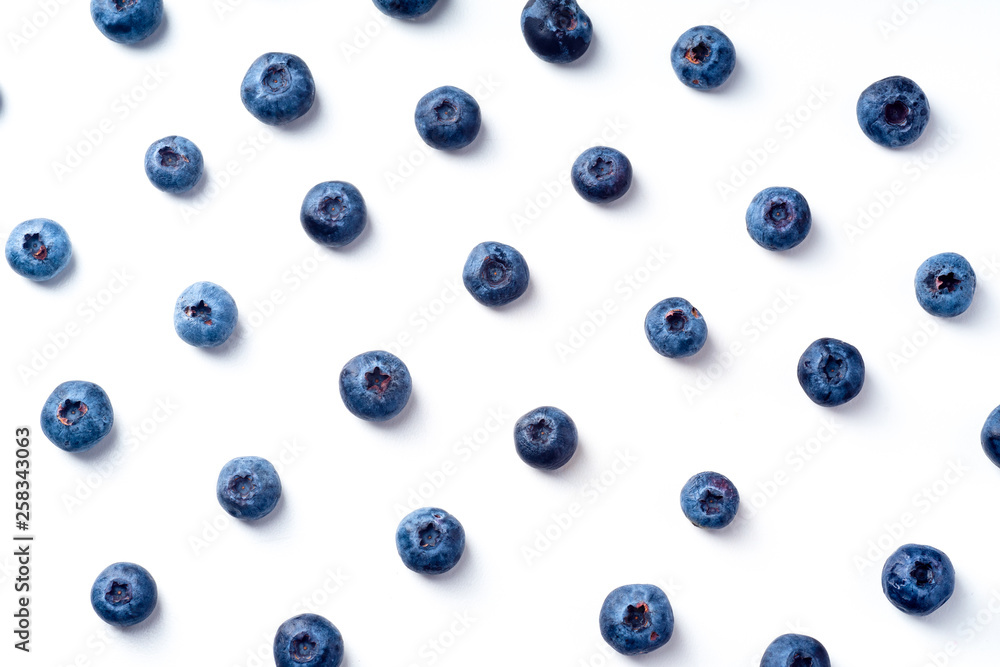 Flatlay pattern with fresh ripe blueberries isolated on white background Flatlay pattern with fresh ripe blueberries isolated on white background