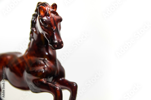 Wooden horse figurine on a white background