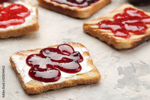Wallpaper Mural toasts with jam. fried crispy toasts with red jam on a light concrete table. breakfast. close-up Torontodigital.ca