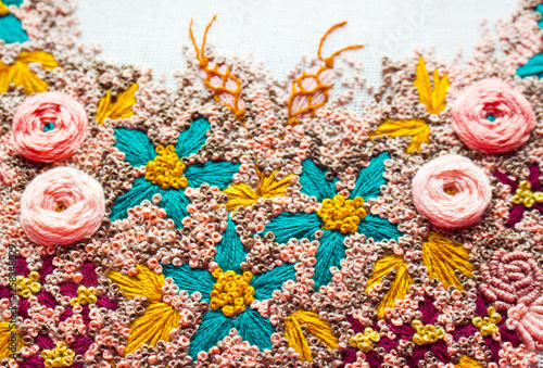 Handmmade work. Embroidery flowers.