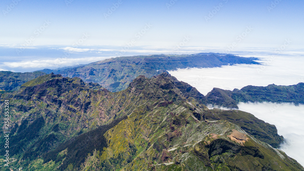 Fototapeta premium Top view of Pico do Arieiro one of the highest peaks in Madeira island. Hiking trail from Pico do Arieiro to Pico Ruivo.