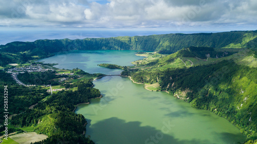 Aerial view on scenic landscape of volcano and green fields around it. Special shape of ground. Top view from drone. Azores islands  Sao Miguel  Portugal.
