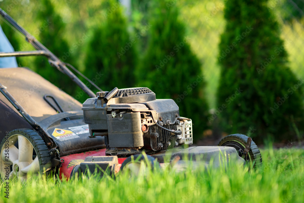 Lawn mower cutting green grass Lawn mower cutting green grass