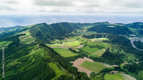 Aerial view on scenic landscape of volcano and green fields around it. Special shape of ground. Top view from drone. Azores islands, Sao Miguel, Portugal. © F8  \ Suport Ukraine