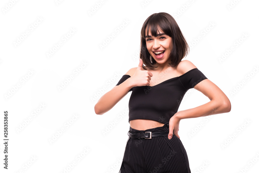 Young happy cheerful woman showing thumb up isolated on white background Young happy cheerful woman showing thumb up isolated on white background
