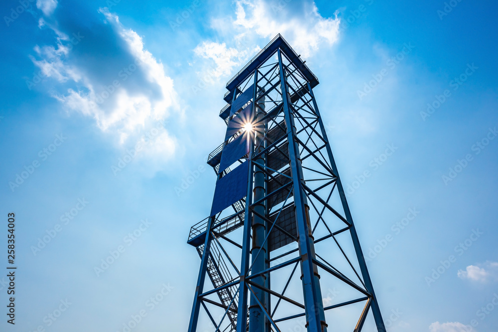industrial chimney against a blue sky industrial chimney against a blue sky