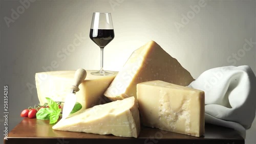 slices of parmesan cheese and red wineglass