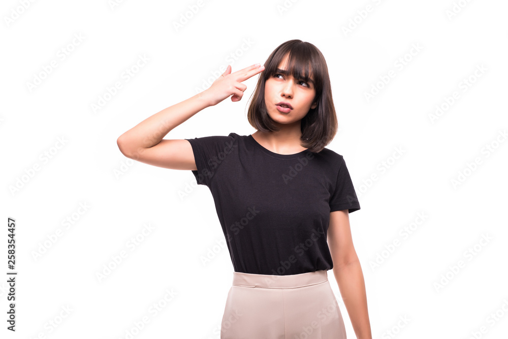 Portrait of pretty unhappy woman with fingers like a gun to her head isolated on white background Portrait of pretty unhappy woman with fingers like a gun to her head isolated on white background