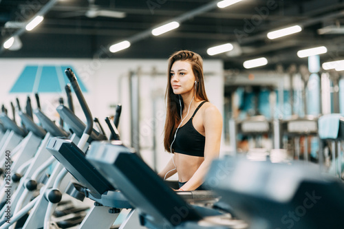 Beautiful girl in the gym. Sports and fitness, healthy lifestyle.