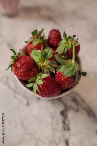 Summer red fruit. A cup of fresh strawberries