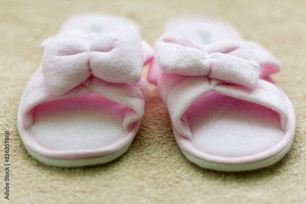home Slippers soft pink on a beige Mat home Slippers soft pink on a beige Mat