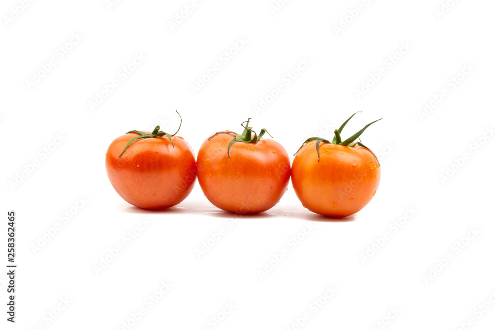 Tomato closeup on white background. Selective focus and crop fragment Tomato closeup on white background. Selective focus and crop fragment