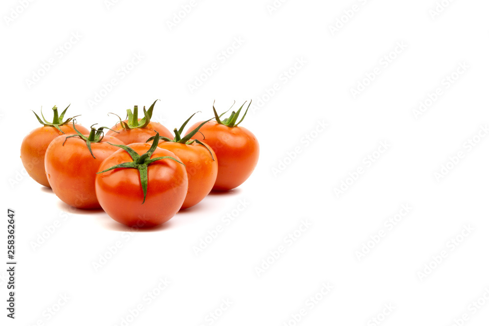 Tomato closeup on white background. Selective focus and crop fragment