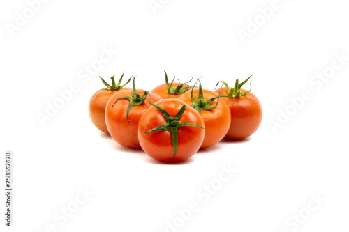 Wallpaper Mural Tomato closeup on white background. Selective focus and crop fragment Torontodigital.ca