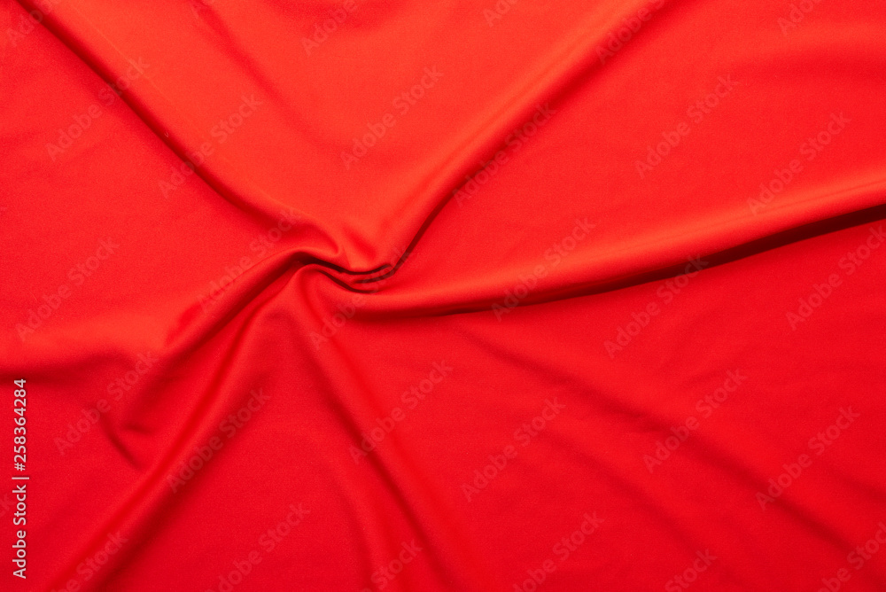 Luxury red silk textile draped in a spyral texture Luxury red silk textile draped in a spyral texture