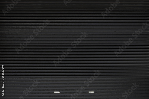 Foto black shutter door with stainless steel holder