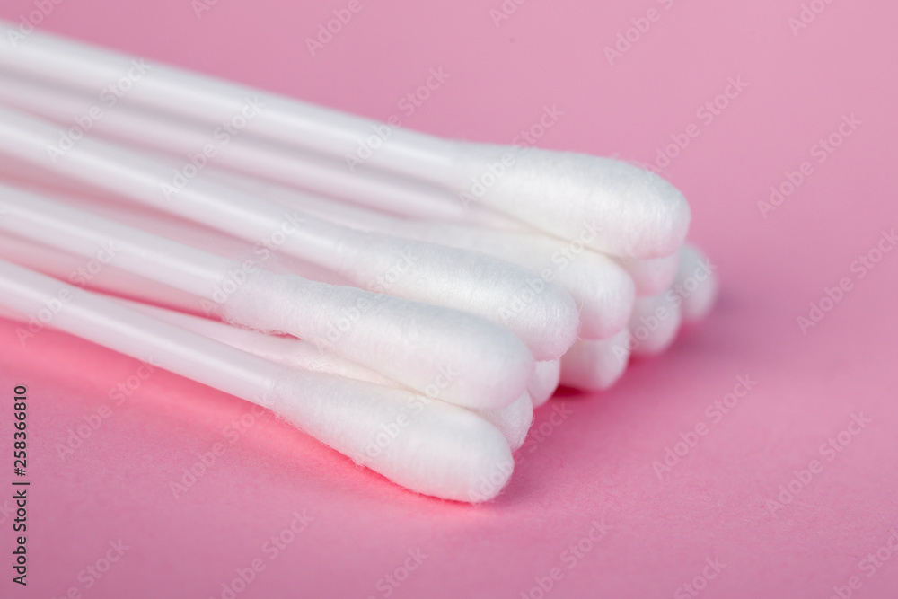 sticks for cleaning ears on a pink background sticks for cleaning ears on a pink background