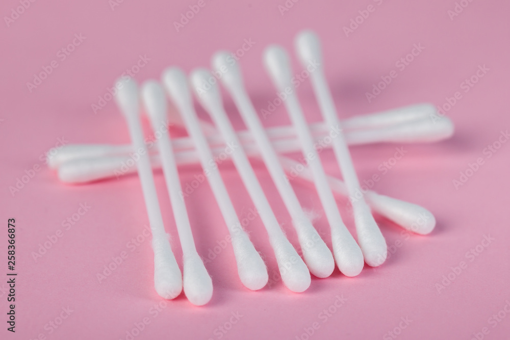 sticks for cleaning ears on a pink background sticks for cleaning ears on a pink background
