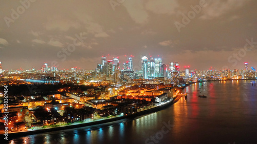 Aerial drone night shot from iconic Canary Wharf skyscrapers business area, Isle of Dogs, London, United Kingdom,  © aerial-drone