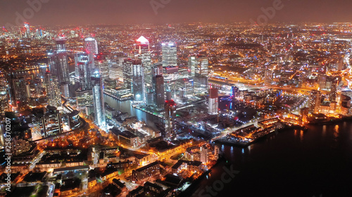 Aerial drone night shot from iconic Canary Wharf skyscrapers business area, Isle of Dogs, London, United Kingdom,  photo