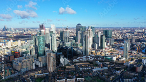 Aerial bird s eye panoramic photo taken by drone of iconic Canary Wharf skyscraper complex and business district  Isle of Dogs  London  United Kingdom