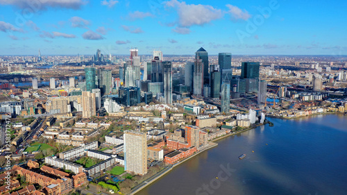 Aerial bird s eye view panoramic drone photo of Greenwich park with views to Canary Wharf and University of Greenwich with beautiful cloudy sky  Isle of Dogs  London  United Kingdom