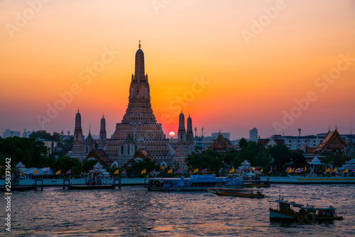 Sunset at Arun Temple or Wat Arun, locate at along the Chao Phraya river with a colorful sky in Bangkok, Thailand