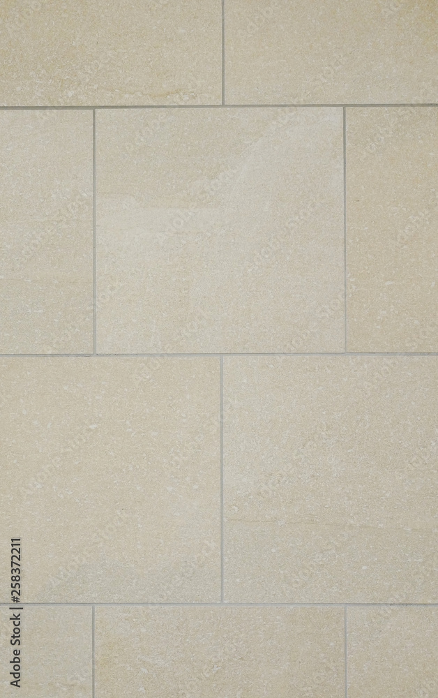 Naklejka premium 壁の大きいタイル、石、背景素材