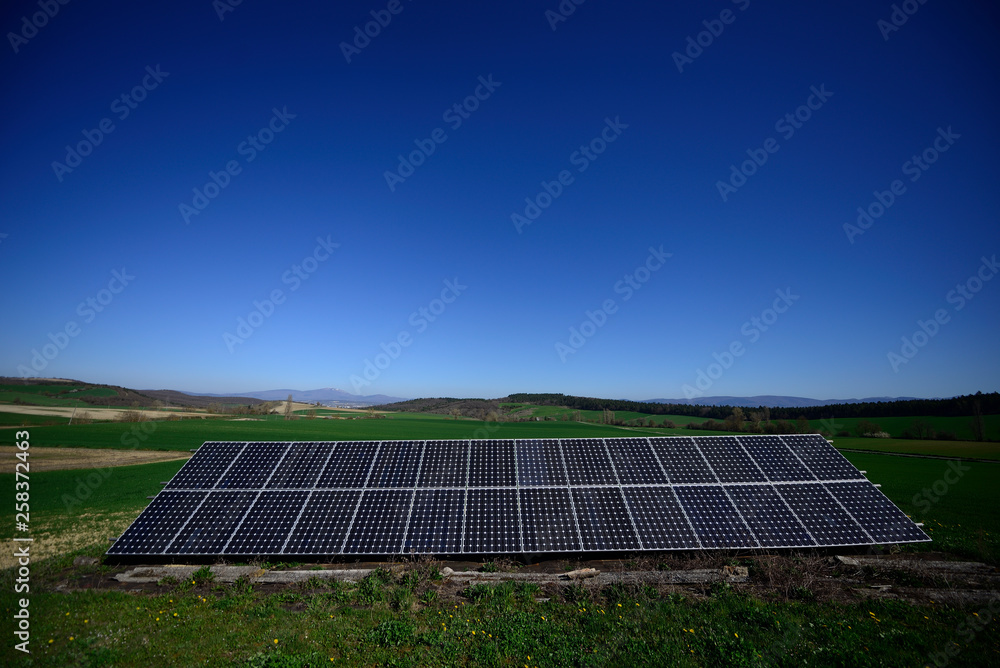 solar panels in a blue sky in the middle of Alava plains, Basque Country, Spain