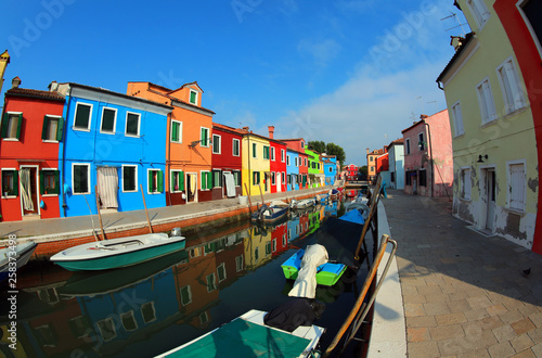 Colored houses and boats of Burano Island near Venice