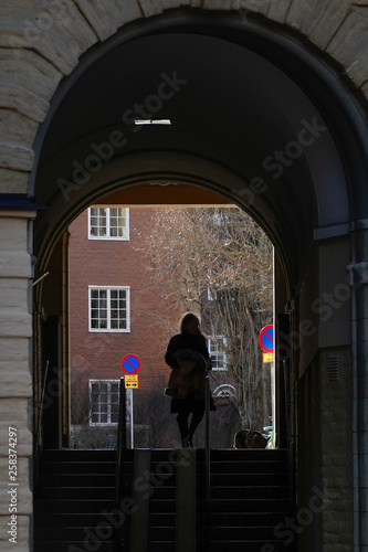 Stockholm, Sweden Pedestrians on Vanadisvägen walking on the Tre Liljor Square and portico. © Alexander
