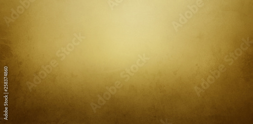 Vintage gold and brown background with old paper or paint texture and elegant antique golden yellow colors