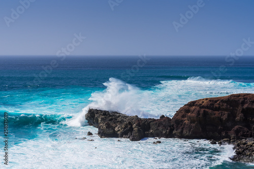Spain, Lanzarote, Giant white splashing wave water at rocky coast