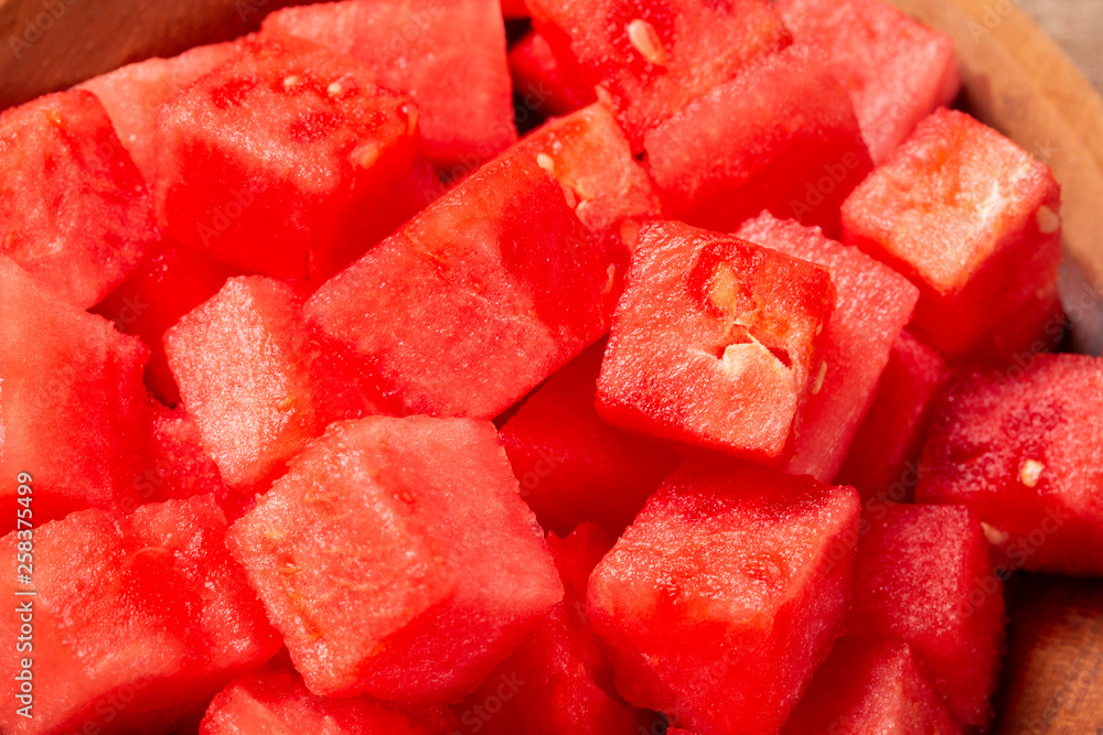 fresh watermelon cut into cubes on wooden bowl fresh watermelon cut into cubes on wooden bowl