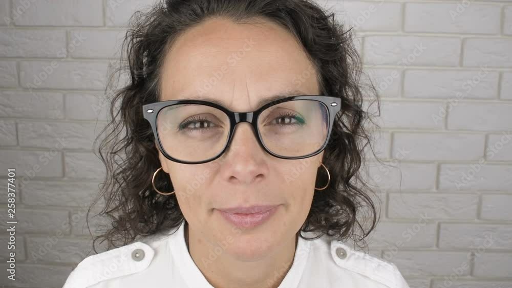 Funny woman with glasses. Close-up of a woman wearing glasses for vision. Funny woman with glasses. Close-up of a woman wearing glasses for vision.