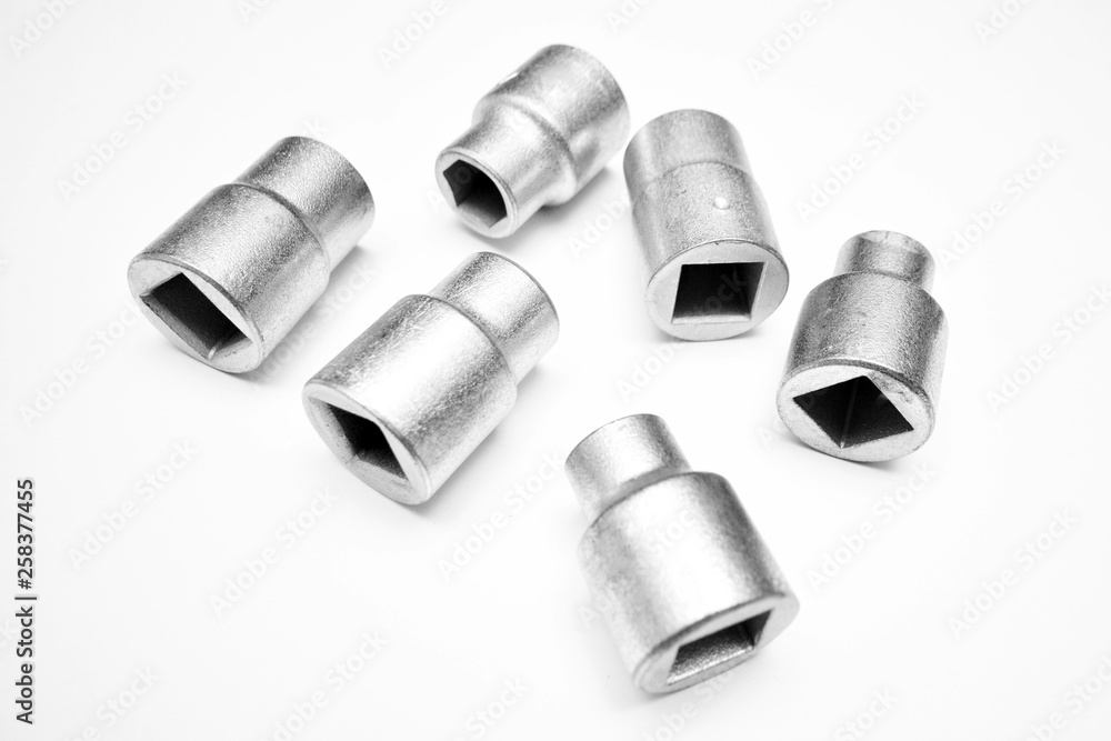 Screwdriver and wrench heads on the white background Screwdriver and wrench heads on the white background