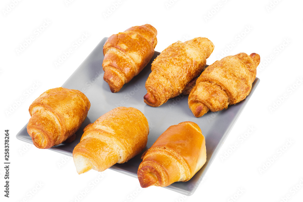 Group of six croissants on gray square shaped plate Group of six croissants on gray square shaped plate
