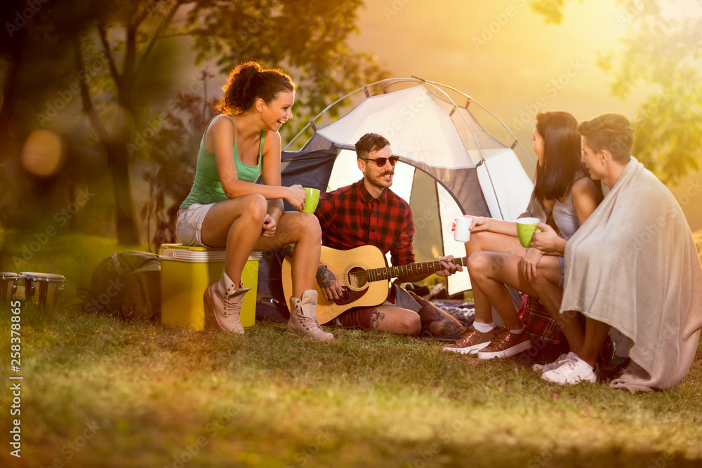 Two couples camping together